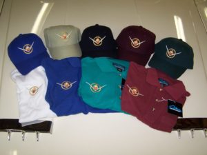 Hats & Shirts with the 1955-56 Vee and Circle logo, with Packard Crest in the enter